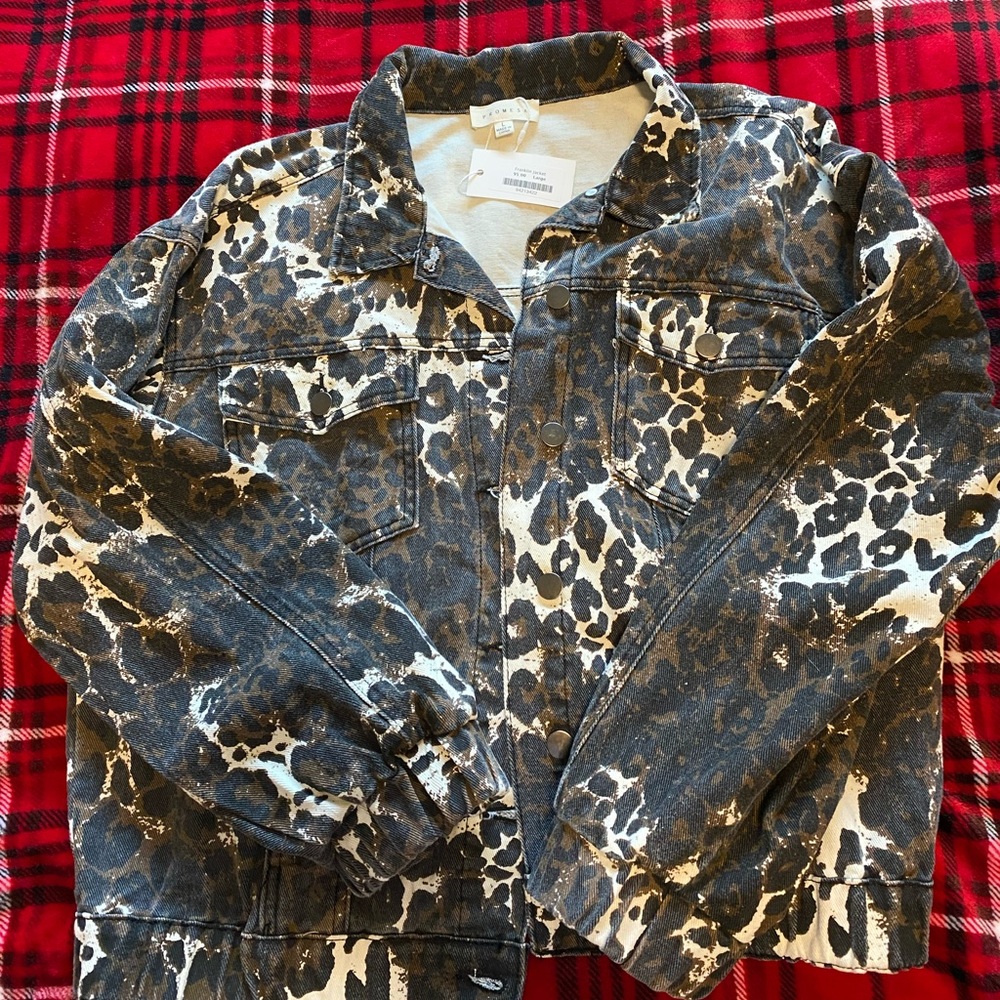 Never been worn with tags still on. Selling this as I have too many jackets.